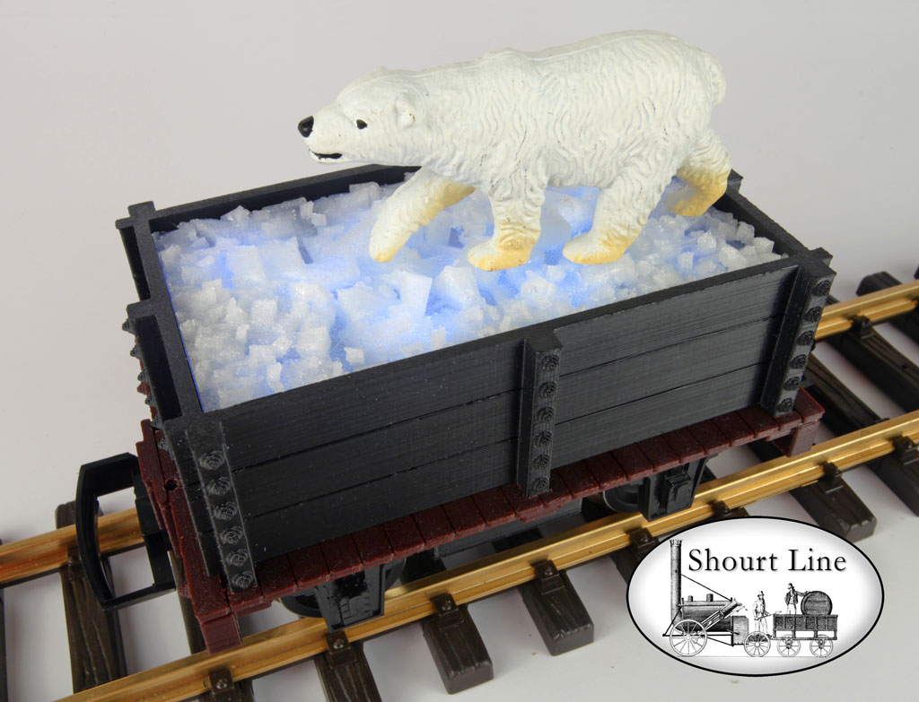 optional Optional SL 2308111 SL mini-car 11 White LED white fixture for ICE lighting mounted on the base of the car and the SL 2308011 Mini Gondola Ice Load dropped into the top of the gondola AND an Optional Polar Bear on the ice.