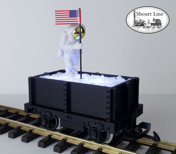 SL 9011139 4th of July Mini-Max Gondola with Ice load lighed by 11 White LEDs, with an Astronaut planting an American Flag on the ice, Track powered, PIKO Metal Wheels LGB Couplers SL WalkWay-Coupler, Assmebled & Wired - Ready to Run NEW - Lighted - On the track right front elevated view